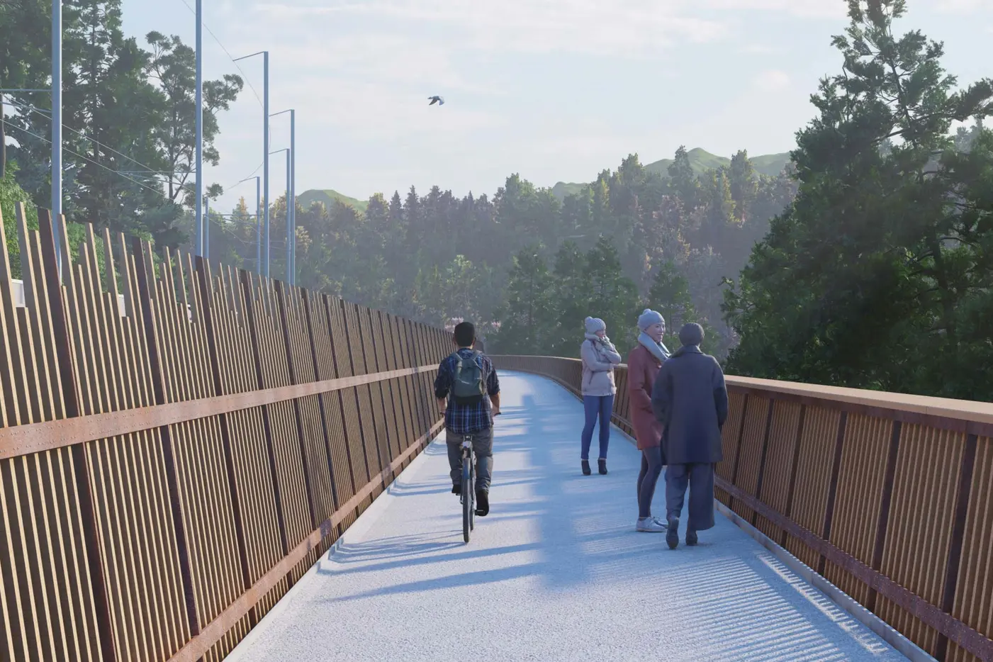 Personen auf einer Brücke, ein Radfahrer befährt den Weg, umgeben von Bäumen.